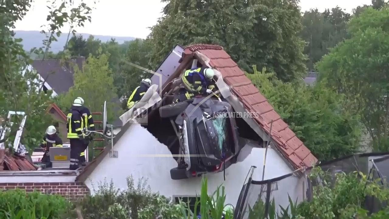 Several hurt in Germany as car gets stuck in roof after racing through garden and hitting child